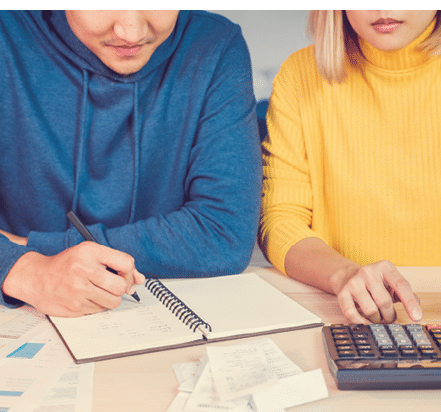 Close up Asian couple list home financial bill budget on table in kitchen at new house