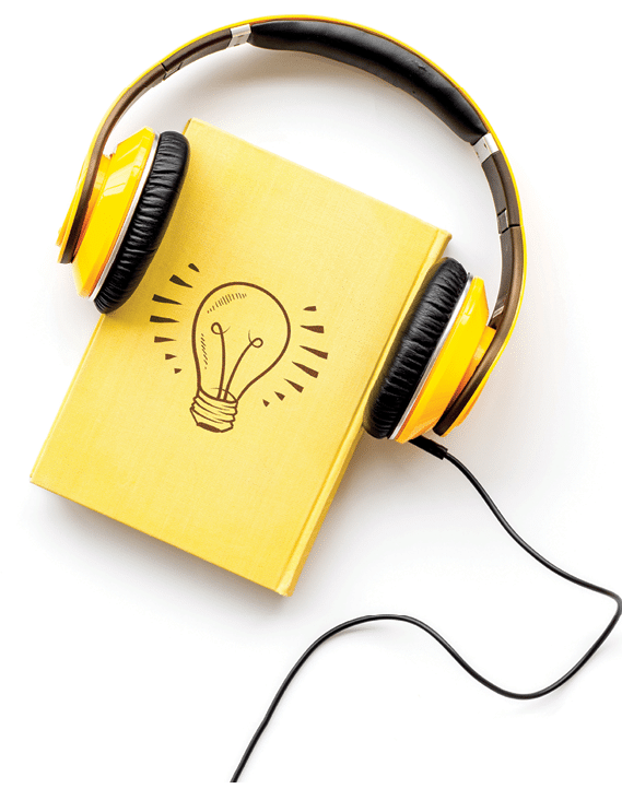 Listening audio books with headphones or earphones in library on wooden desk background top view space for text